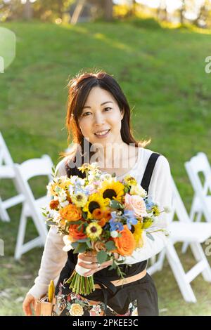 Florist woman with bouquet Stock Photo