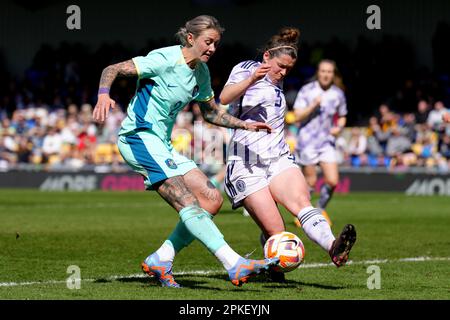 Australia's Larissa Crummer (left) shoots under pressure from Scotland's Emma Mukandi during an International Friendly match at Cherry Red Records Stadium, London. Picture date: Friday April 7, 2023. Stock Photo