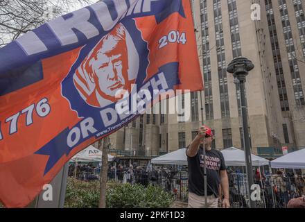 NEW YORK, N.Y. – April 4, 2023: A demonstrator is seen in Lower Manhattan before an arraignment hearing for former President Donald Trump. Stock Photo