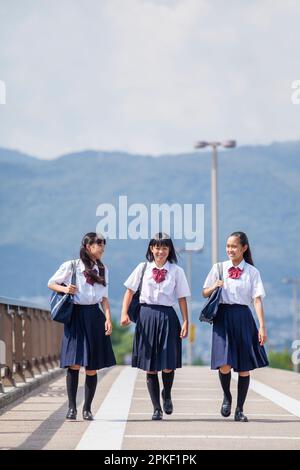 Junior high students walking in corridor Stock Photo - Alamy