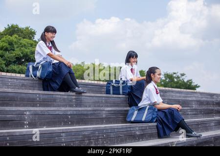 Junior High School Students Sitting on the Stairs Stock Photo