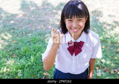 Junior high school students doing guts with one hand Stock Photo