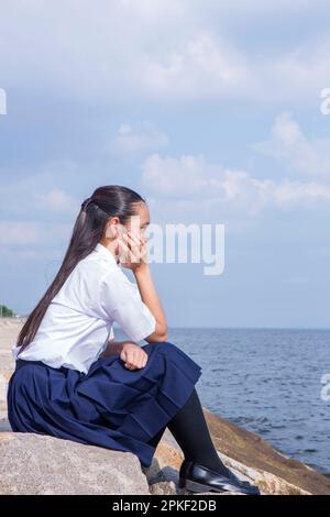 Junior High School Students on the Beach with Cheek Cuppers Stock Photo