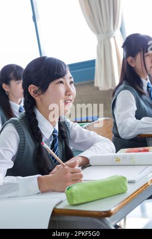 Junior high school girls taking a class Stock Photo