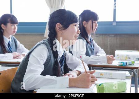 Junior high school girls taking a class Stock Photo