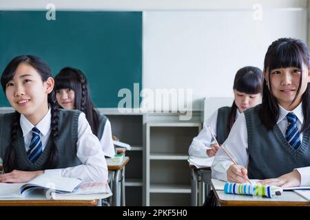 Junior high school girls taking a class Stock Photo