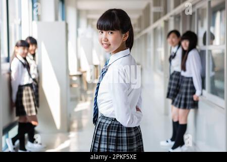 Junior High School Girls Standing in the Hallway Stock Photo - Alamy