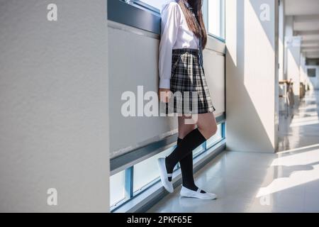 Junior high school girls standing in the hallway Stock Photo