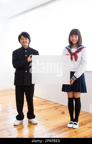 Junior high school students with boards Stock Photo