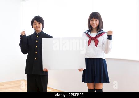Junior high school students with boards Stock Photo