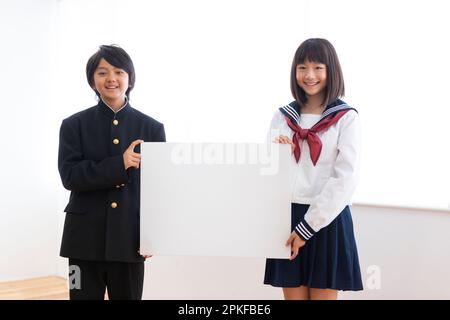 Junior high school students with boards Stock Photo