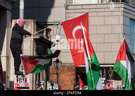 Kensington High Street, Kensington, London, UK. 7th Apr, 2023. A protest by supporters of Palestine is taking place outside the embassy of Israel in Kensington followed by a march along the High Street, protesting against the actions of Israel Stock Photo