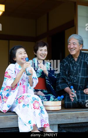 Girl drinking a Ramune Stock Photo