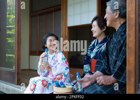 Girl drinking a Ramune Stock Photo