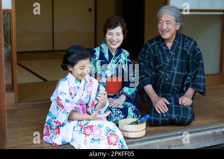 Girl drinking a Ramune Stock Photo