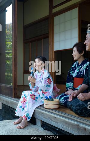 Girl drinking a Ramune Stock Photo