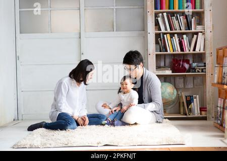 Family hanging out in the living room Stock Photo