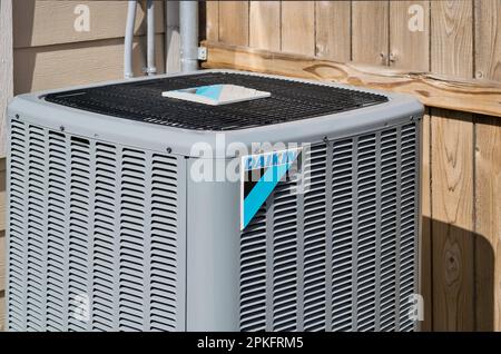 Houston, Texas USA 08-08-2022: Daikin air conditioner unit, corner view with logo and wooden fence in the background. Stock Photo