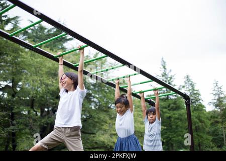 Elementary school children doing cartwheels Stock Photo