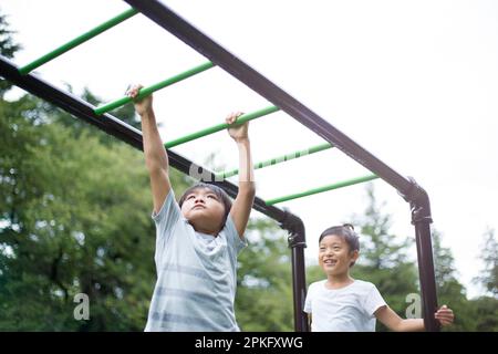 Elementary school children doing a cartwheel Stock Photo