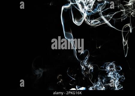 Smoke effect texture. Isolated background. Black and dark backdrop. Smokey fire and mistic effect. Spirit wave. Photo realistic mist stock image. Stock Photo
