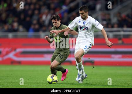 Milano, Italy. 07th Apr, 2023. Brahim Diaz of Ac Milan and Alberto Grassi of Empoli Fc battle for the ball during the Serie A match beetween Ac Milan and Empoli Fc at Stadio Giuseppe Meazza on April 7, 2023 in Milano, Italy . Credit: Marco Canoniero/Alamy Live News Stock Photo
