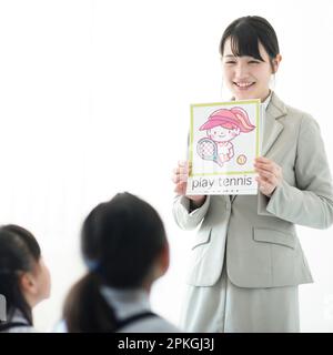Teachers who teach English to elementary school students Stock Photo