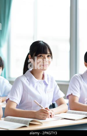 A nursing student taking a class in a classroom Stock Photo