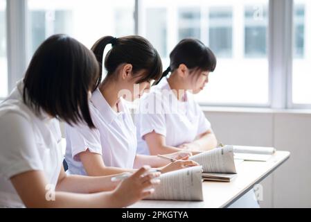 Nursing students taking a class in a classroom Stock Photo