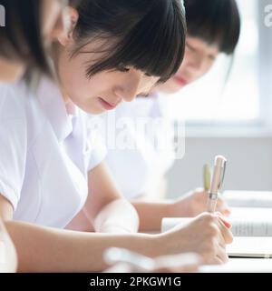 Nursing student taking a class in a classroom Stock Photo