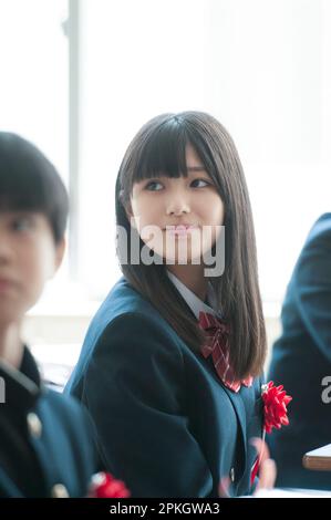 Female student smiling in class Stock Photo