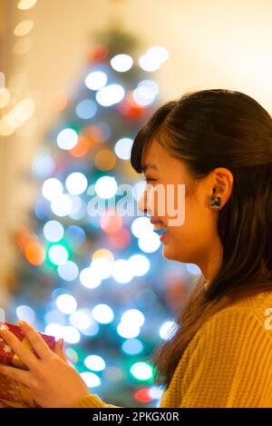 Woman smiling in front of illumination Stock Photo