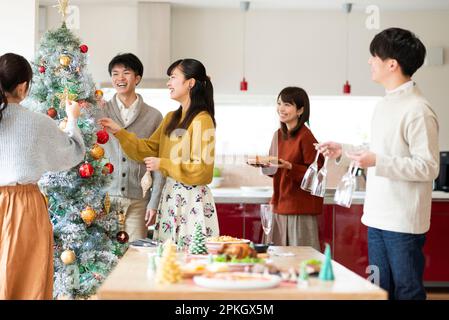 Young people preparing for a Christmas party Stock Photo