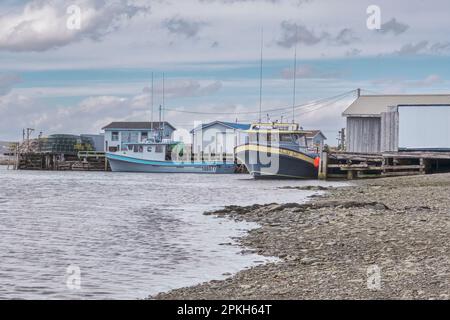 Fishing boats tied up at the wharf in Gabarus Nova Scotia.  Established in 1716 the villiage was once and important fisheries centre however it now re Stock Photo