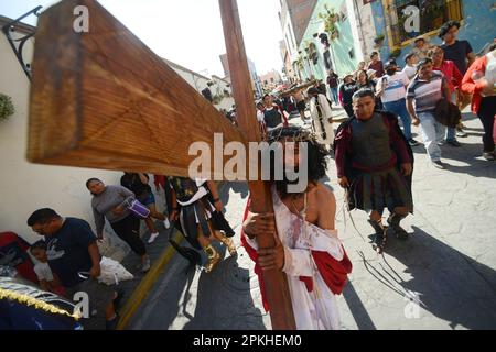 Atlixco, Mexico. 7th Apr, 2023. A person representing Jesus, takes part during the Representation of the Stations of the Cross on Good Friday as part of the Holy Week Celebrations. on April 7, 2023 in Atlixco, Mexico. (Credit Image: © Carlos Tischler/eyepix via ZUMA Press Wire) EDITORIAL USAGE ONLY! Not for Commercial USAGE! Stock Photo