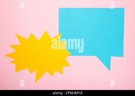 Dialog - two blank speech bubbles on pink backgrounnd. Top view Stock Photo