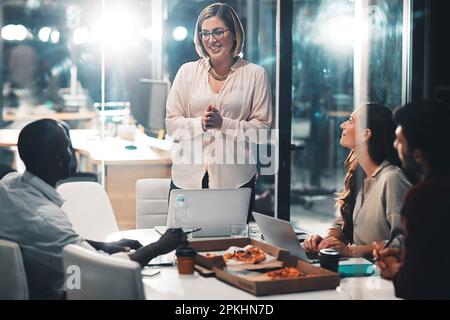 Achieving project success collectively. colleagues collaborating on a project in a modern office. Stock Photo