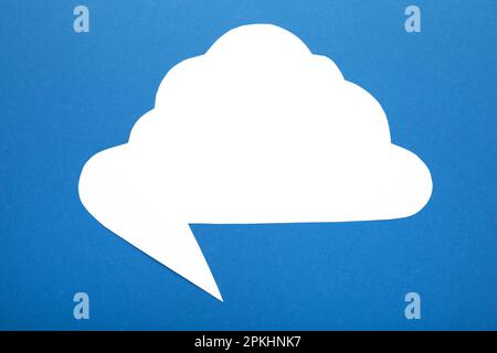 White paper speech bubble on blue background. Top view Stock Photo
