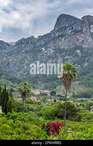 Mountain landscape with rocky mountain peaks, in the back mountain village Biniaraix, hiking trail from Soller to Fornalutx, Serra de Tramuntana Stock Photo