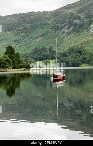 Red Yacht Moored at Ullswater Stock Photo - Alamy