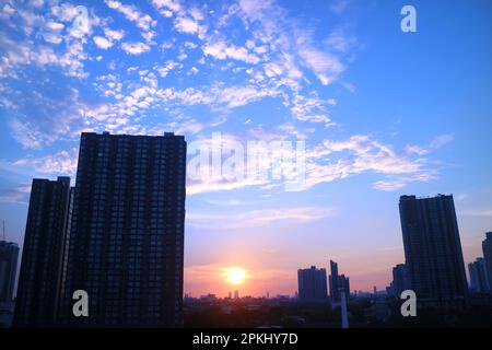 Impressive sunset over group of skyscrapers in the city Stock Photo