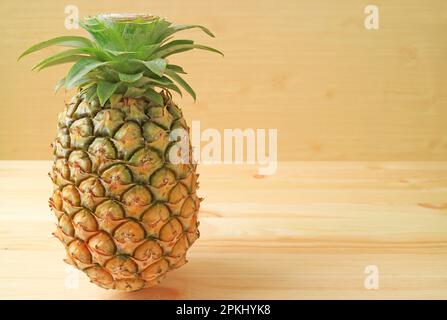 Fresh Ripe Pineapple Isolated on Wooden Background Stock Photo