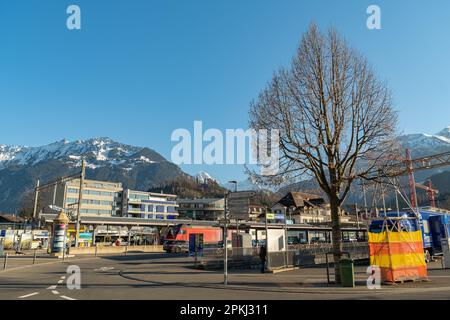 Interlaken, Switzerland, February 10, 2023 Little square with some traffic in the city center Stock Photo