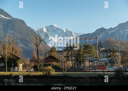 Interlaken, Switzerland, February 10, 2023 Alpine scenery at the river promenade in the city center Stock Photo