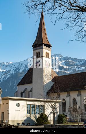 Interlaken, Switzerland, February 10, 2023 Historic old catholic church in the city center Stock Photo