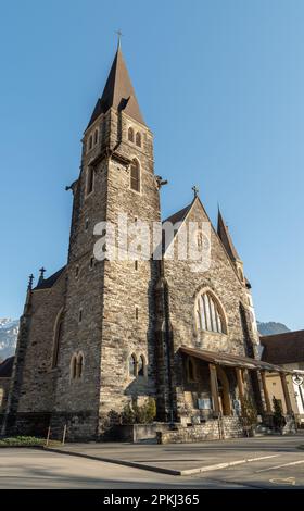 Interlaken, Switzerland, February 10, 2023 Historic old catholic church in the city center Stock Photo