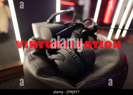 Virtualization concept. Professional headphones with microphone and vr glasses for video games and cyber sports on background. Stock Photo