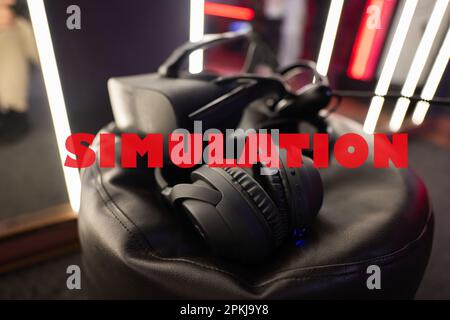 Simulation concept. Professional headphones with microphone and vr glasses for video games and cyber sports on background. Stock Photo