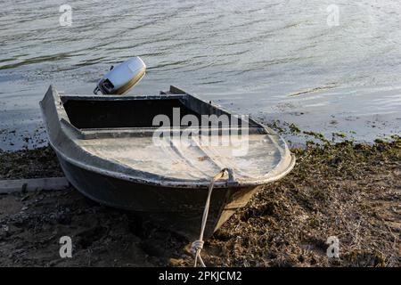 the boat stands on the bank of the river. Means of transportation on water. Stock Photo