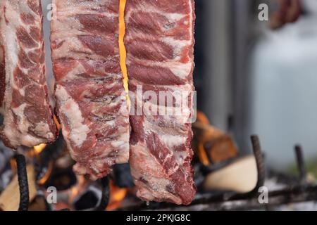 tasty rack of pork ribs cooking on barbecue Stock Photo